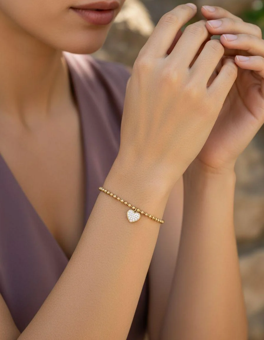 BRACELET EN ACIER DORE PENDENTIF CŒUR STRASS - Image 2